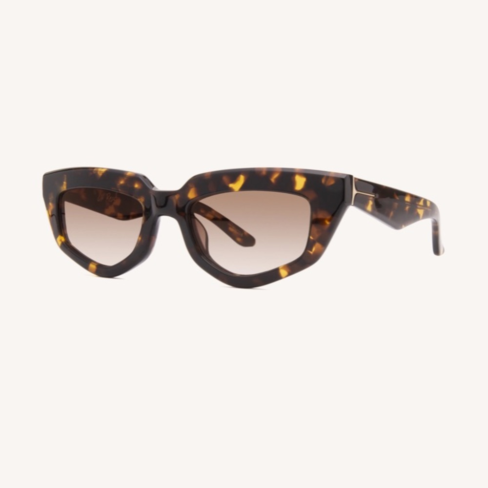 Dezi on read sunglasses in classic tortoise